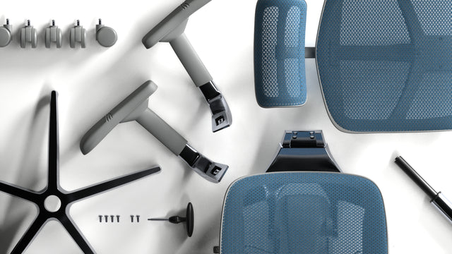 Flatlay shot of a blue enjoy elite office chair unassembled, lying on the floor, ready to be assembled. the separate pieces are the backrest, seat, armrests, 5-star base, gas stem, and castors.