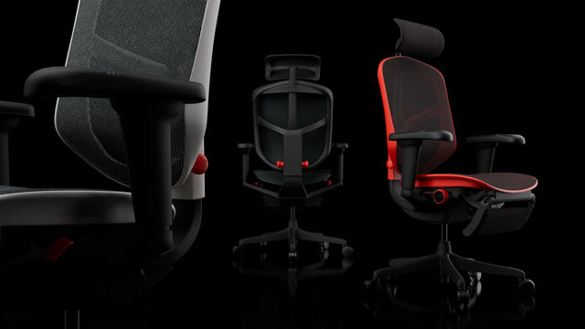 Three ergonomic gaming chairs, the Enjoy Ultra, against a black background. On the right is the red edition gaming chair, facing the right. In the middle is the black gaming chair facing the back. On the left is the white Enjoy Ultra gaming chair, facing the front left.