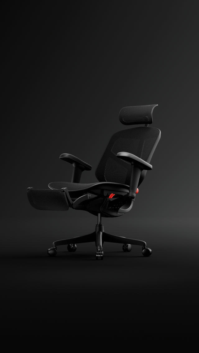 Black Enjoy Ultra gaming chair in a black studio space reclining with the footrest opening. 
