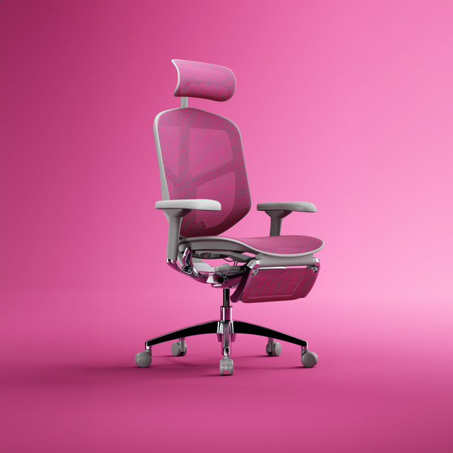 Pink office chair with grey frame. Enjoy Elite with headrest and legrest. Positioned 45-degrees to the right in a pink studio space. 