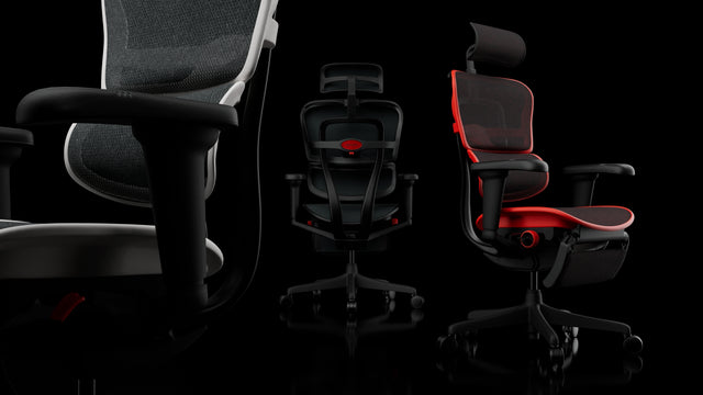 3 Ergohuman Ultra chairs in black, red, and white, all facing a different direction. Against a black background. On the image are white dots which, if you click, bring up text to describe the various features of the chair