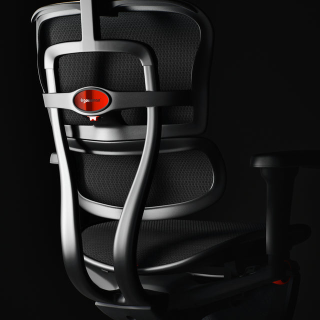premium ergonomic gaming chair - ergohuman ultra in black against a black background