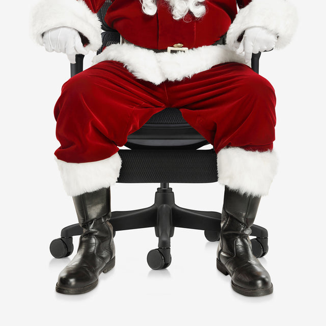 Santa is sitting on a black Ergohuman gaming chair